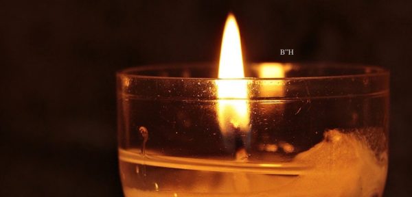 orange yahrzeit memorial candle remembering a child