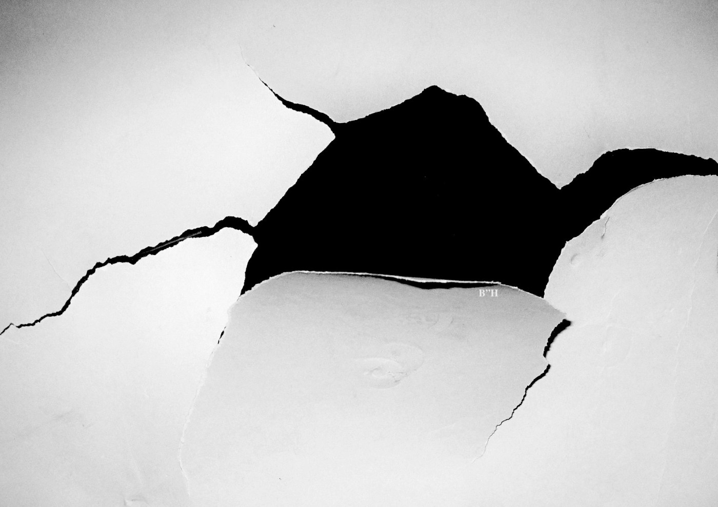 ripped hole in paper, children torn away from parents
