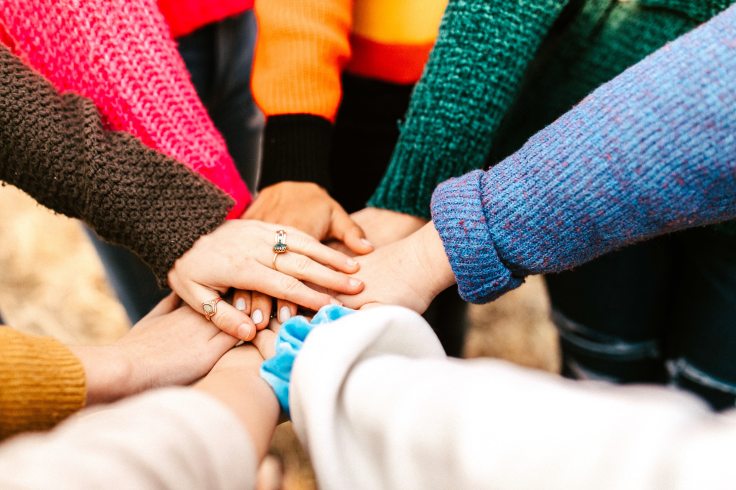 people holding hands. support for child loss
