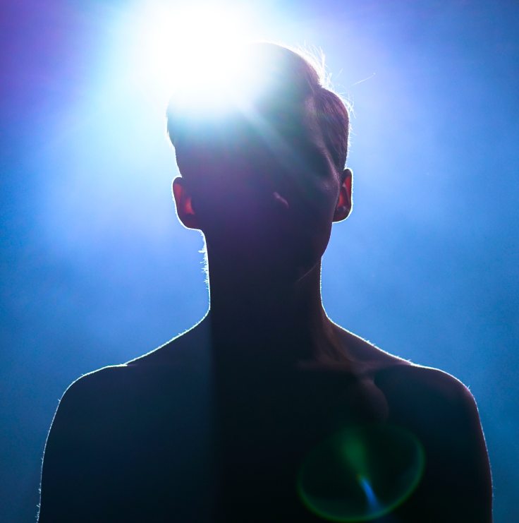 upper body of man silhouette on blue background