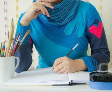 woman deciding what to draw
