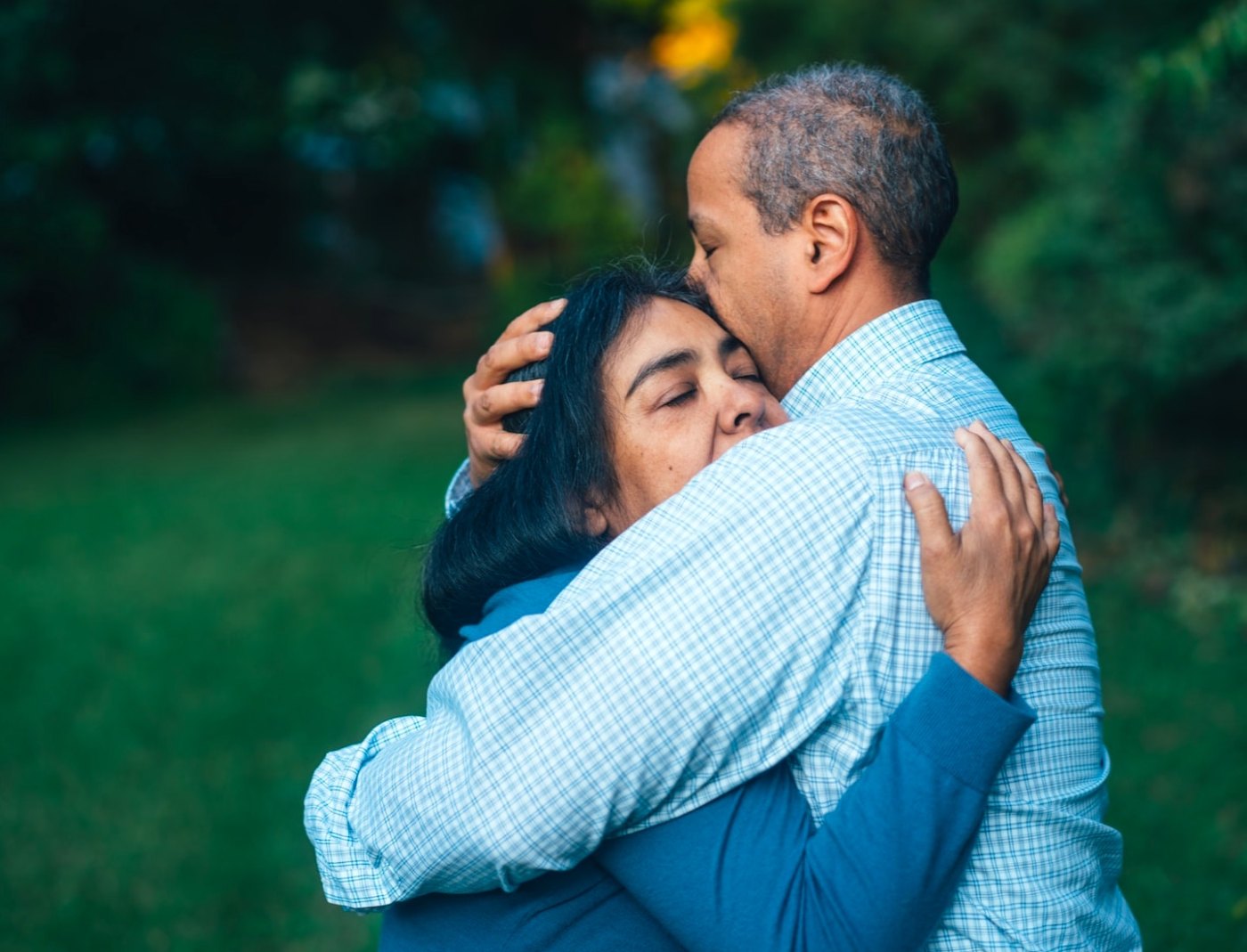 older couple, man and woman hugging