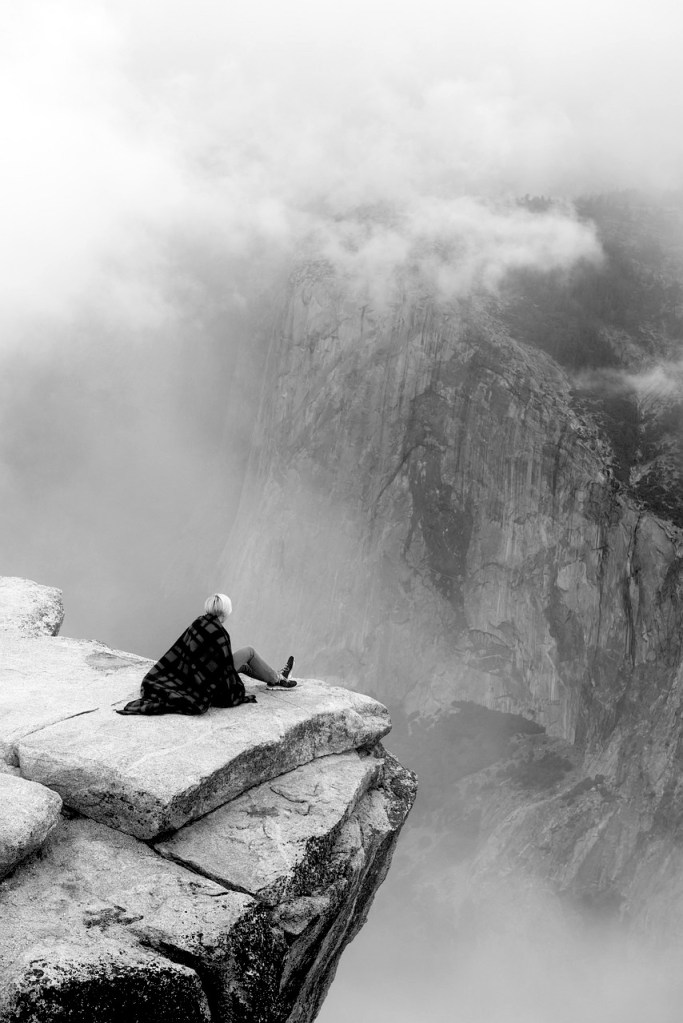 sitting on a cliff