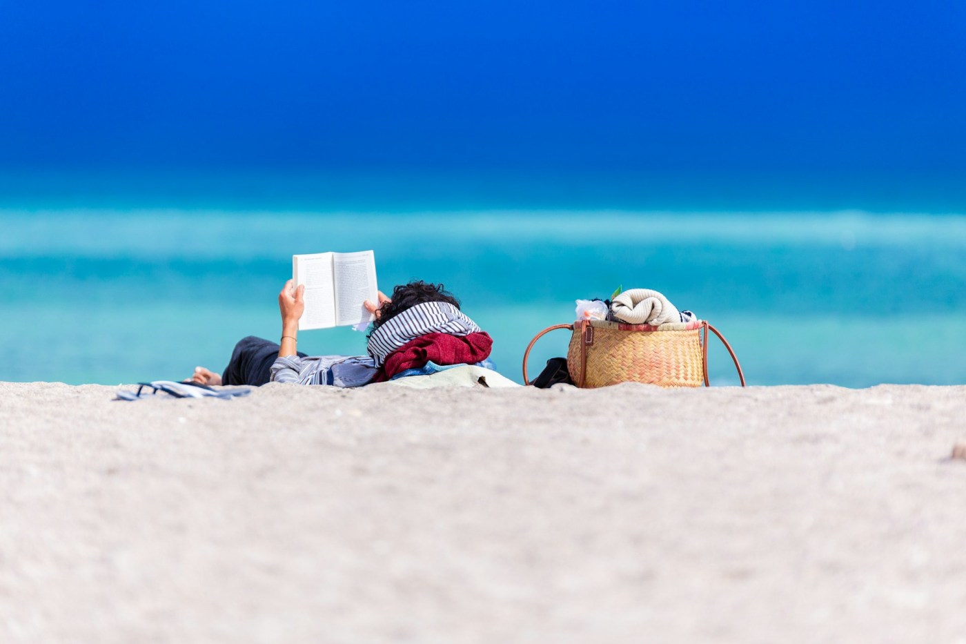 reading on beach distraction coping with grief