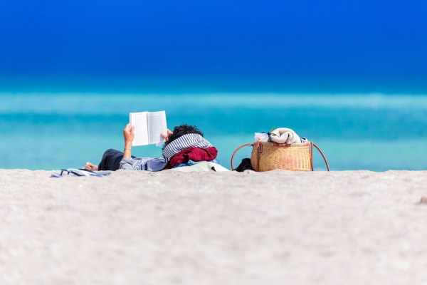 reading on beach distraction coping with grief