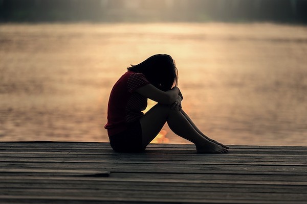 sad woman by the water, miscarriage, child loss at any age sad woman by the water, miscarriage, child loss at any age