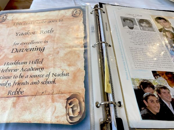 Scrapbooking Jacob's accomplishments. Keeping a child's memory alive.